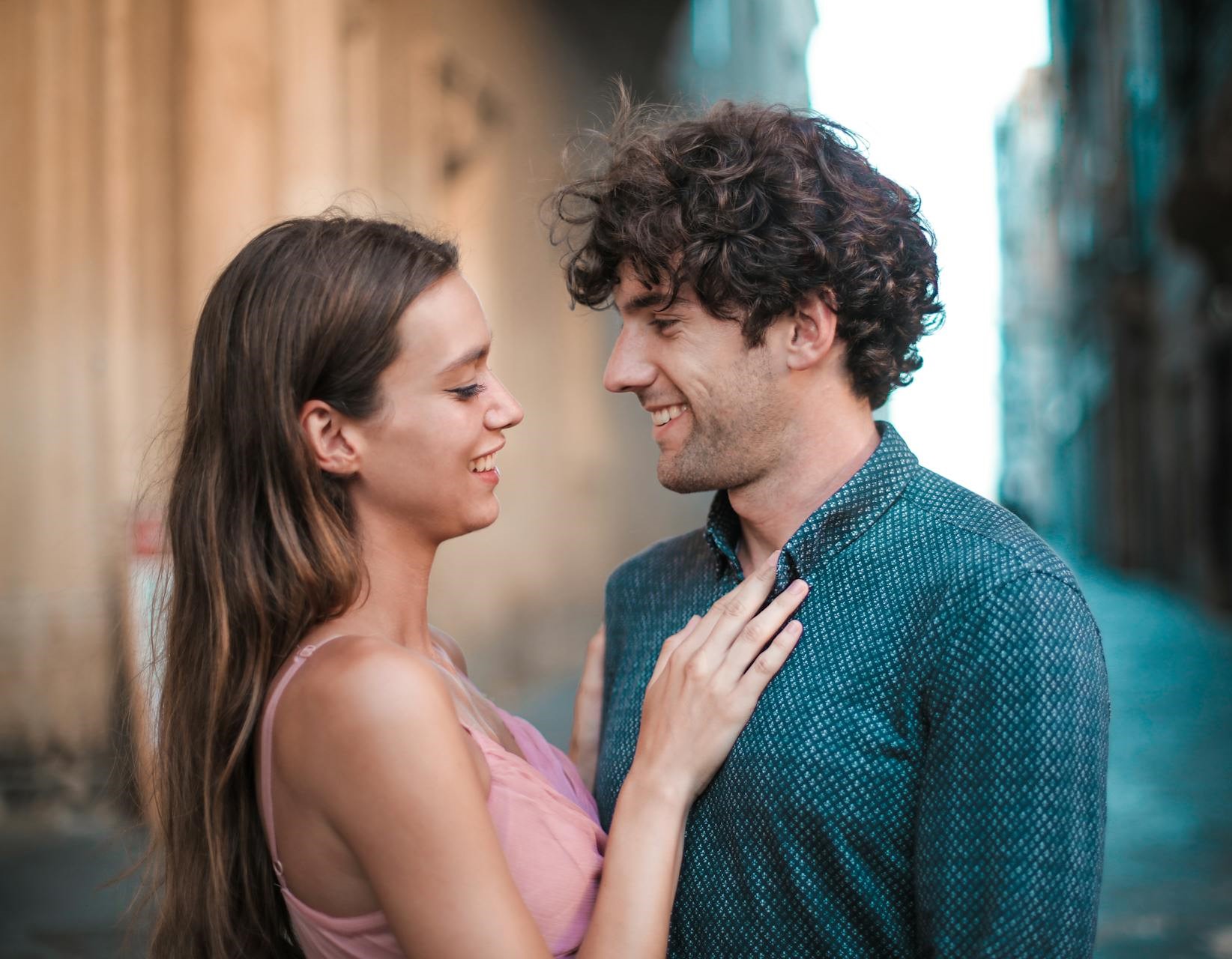 Young couple with girl touching the man's chest in the city