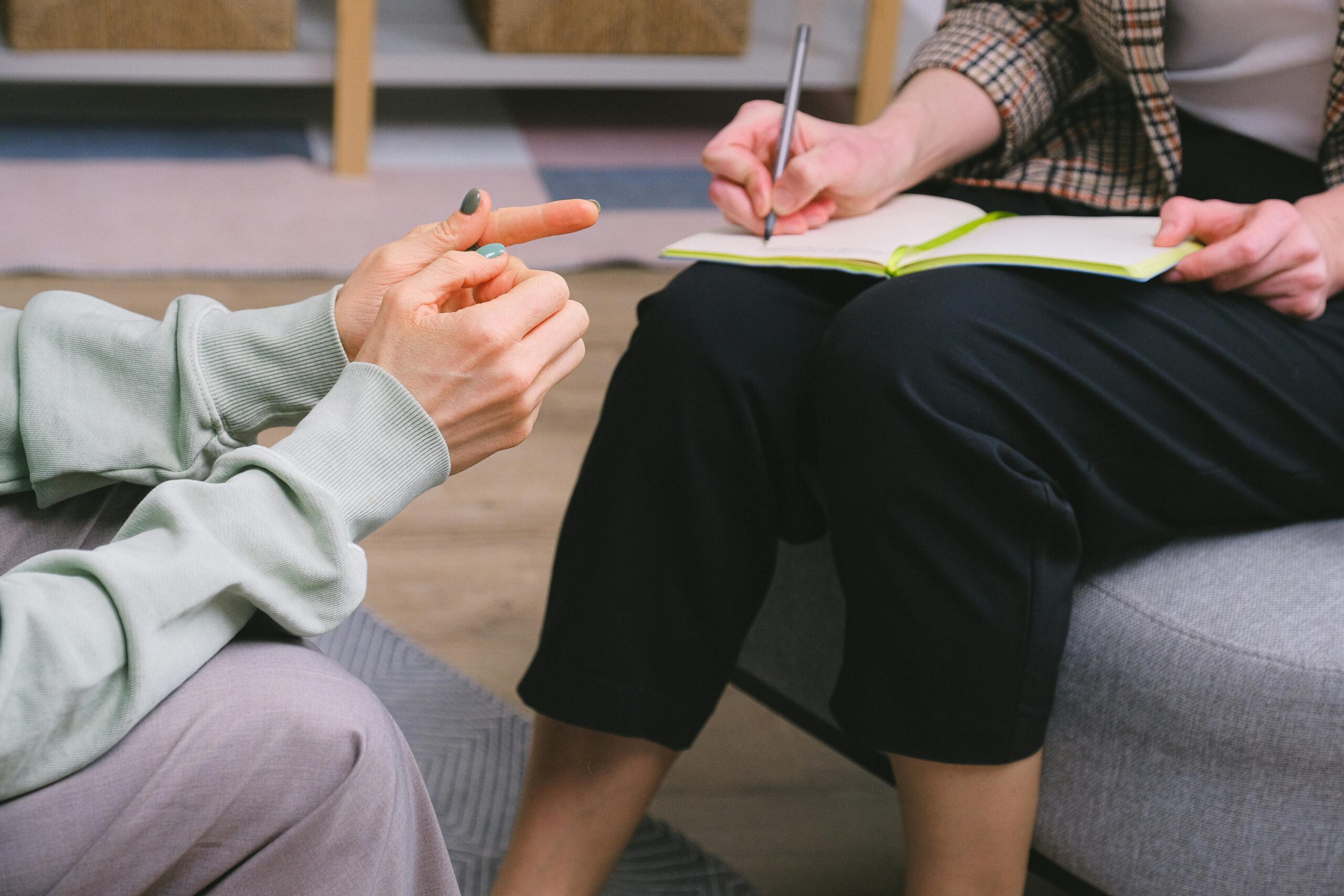 Patient doing assessment while therapist is taking notes